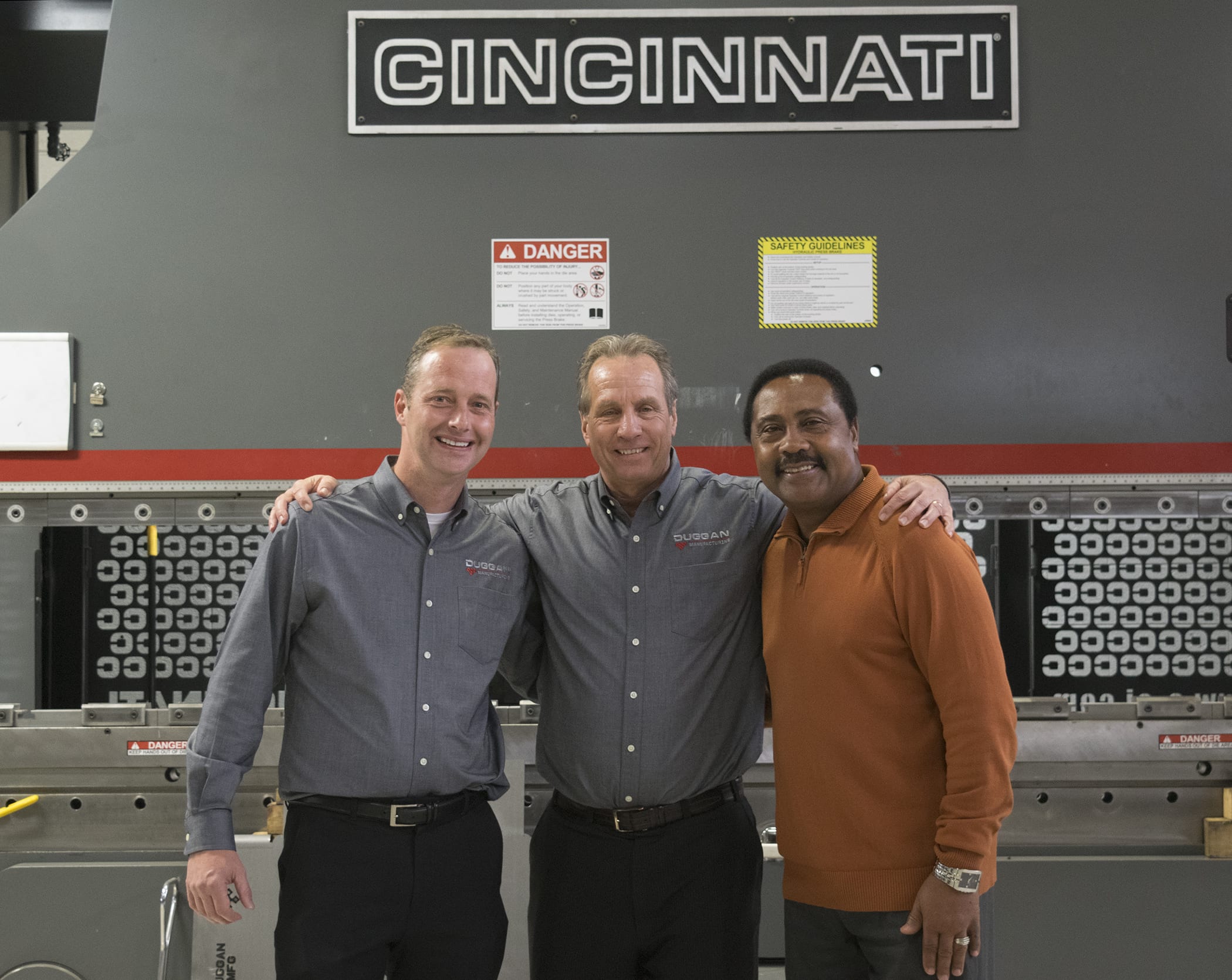 Manufacturing Executives in front of Cincinnati CNC machine